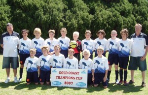 Led by current junior coach Paul Bebbington (left) Modbury Under 12s team contested the Gold Coast Champions Cup in 2007 with current A-League players Brandon Borrello (4th left), Jacob Melling (7th left) and longstanding Modbury players Chris Fleming (front left) and Mitch Coull (front right).
